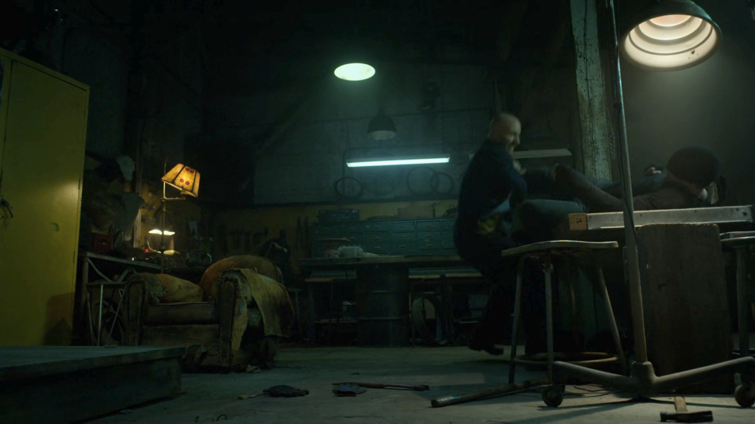 Matt and Melvin fighting in Melvin's new workshop.