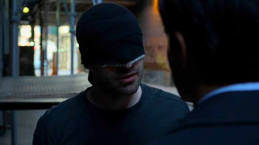 Agent Nadeem in an alley with Daredevil.