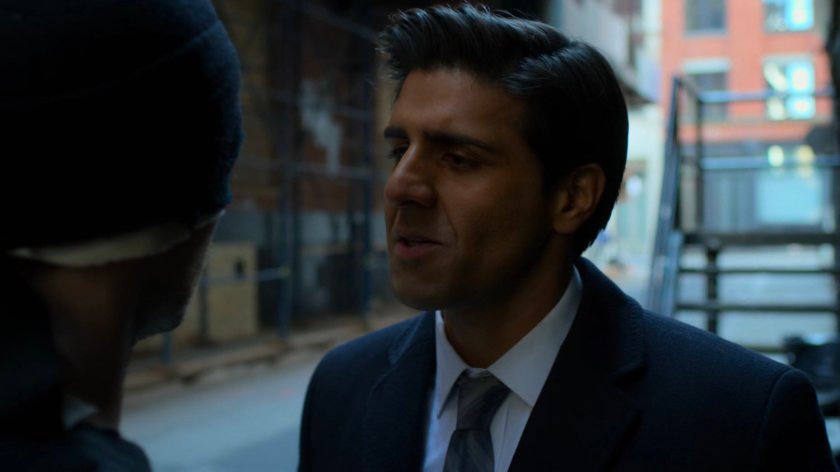 Agent Nadeem in an alley with Daredevil.