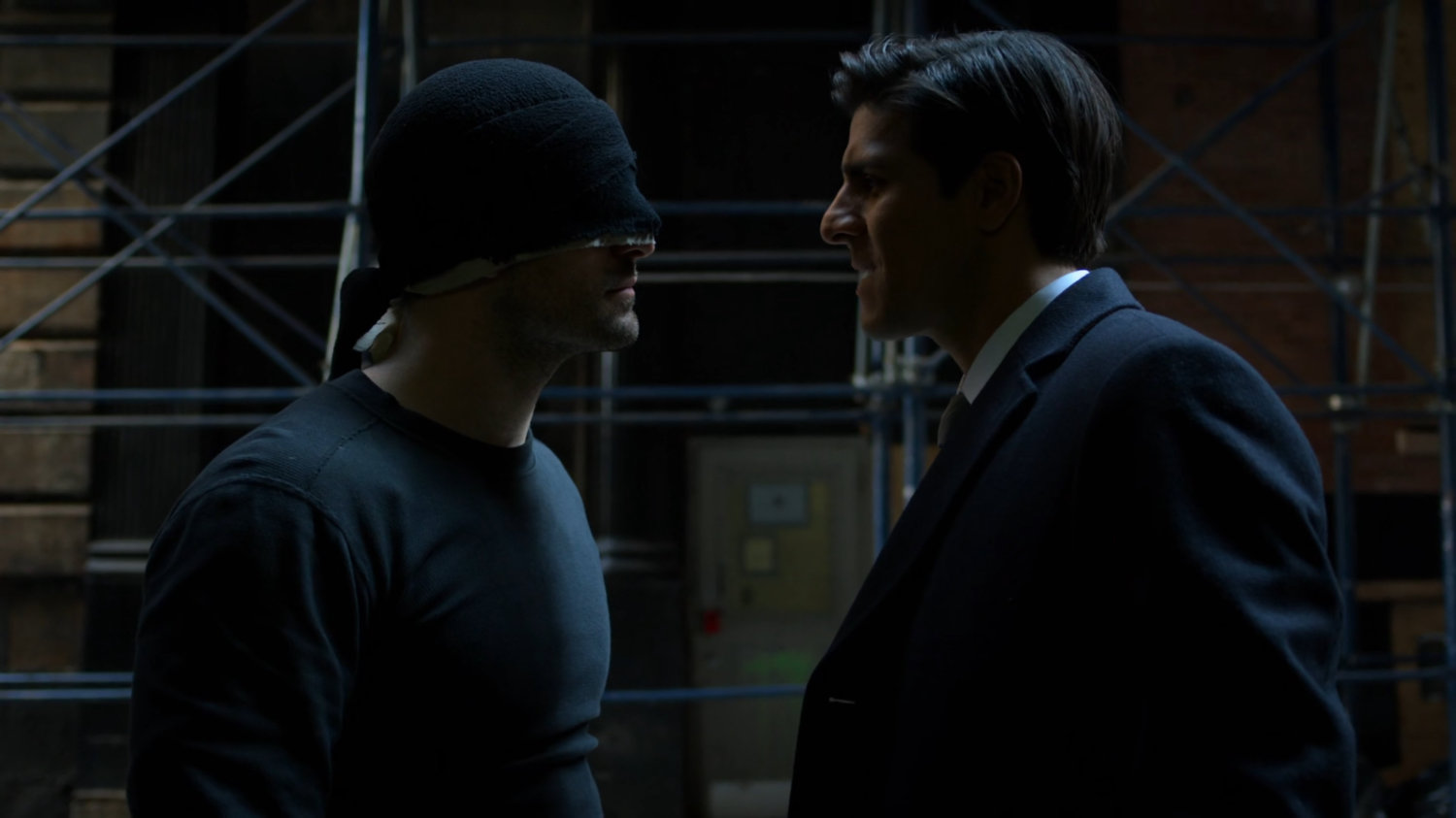 Agent Nadeem in an alley with Daredevil.