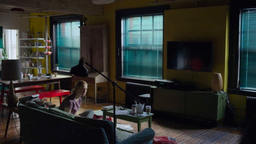 Karen on the couch in her apartment.