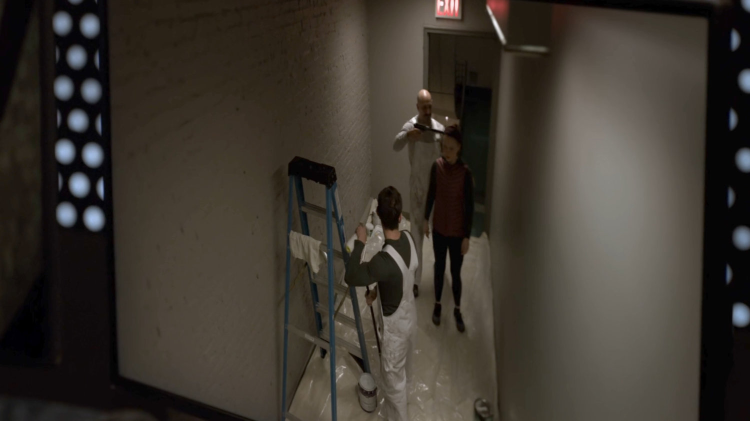 Video feed of Julie about to be shot in the hallway outside her apartment.