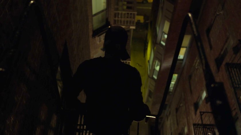 Matt climbing down the fire escape of Dex's apartment.