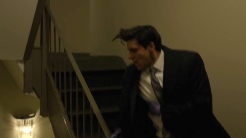 Nadeem running down the stairs in Dex's complex.