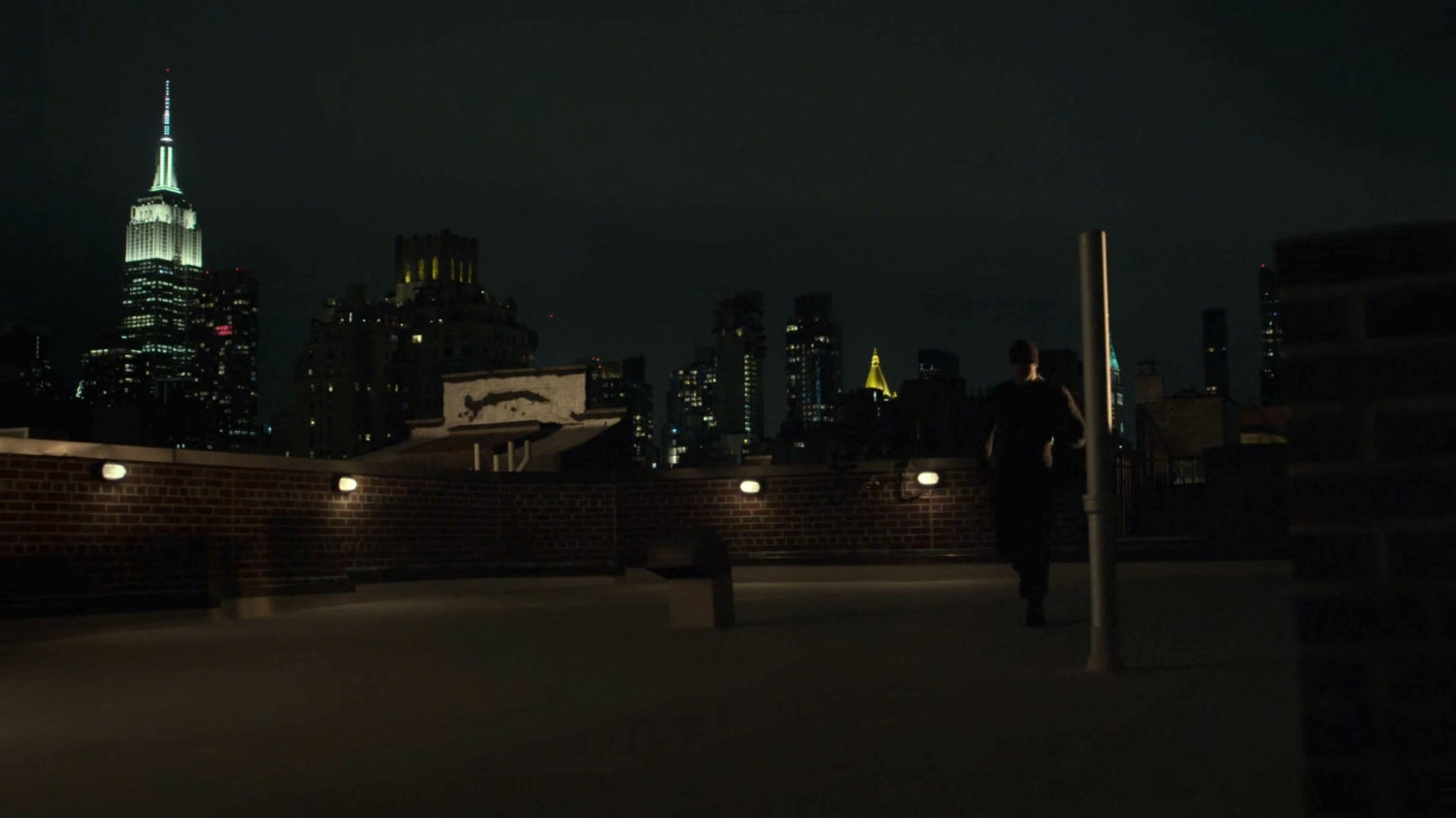 Matt on the rooftop of Dex's apartment.