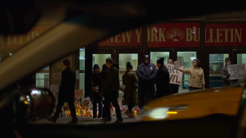 Karen's POV of protestors outside the New York Bulletin.