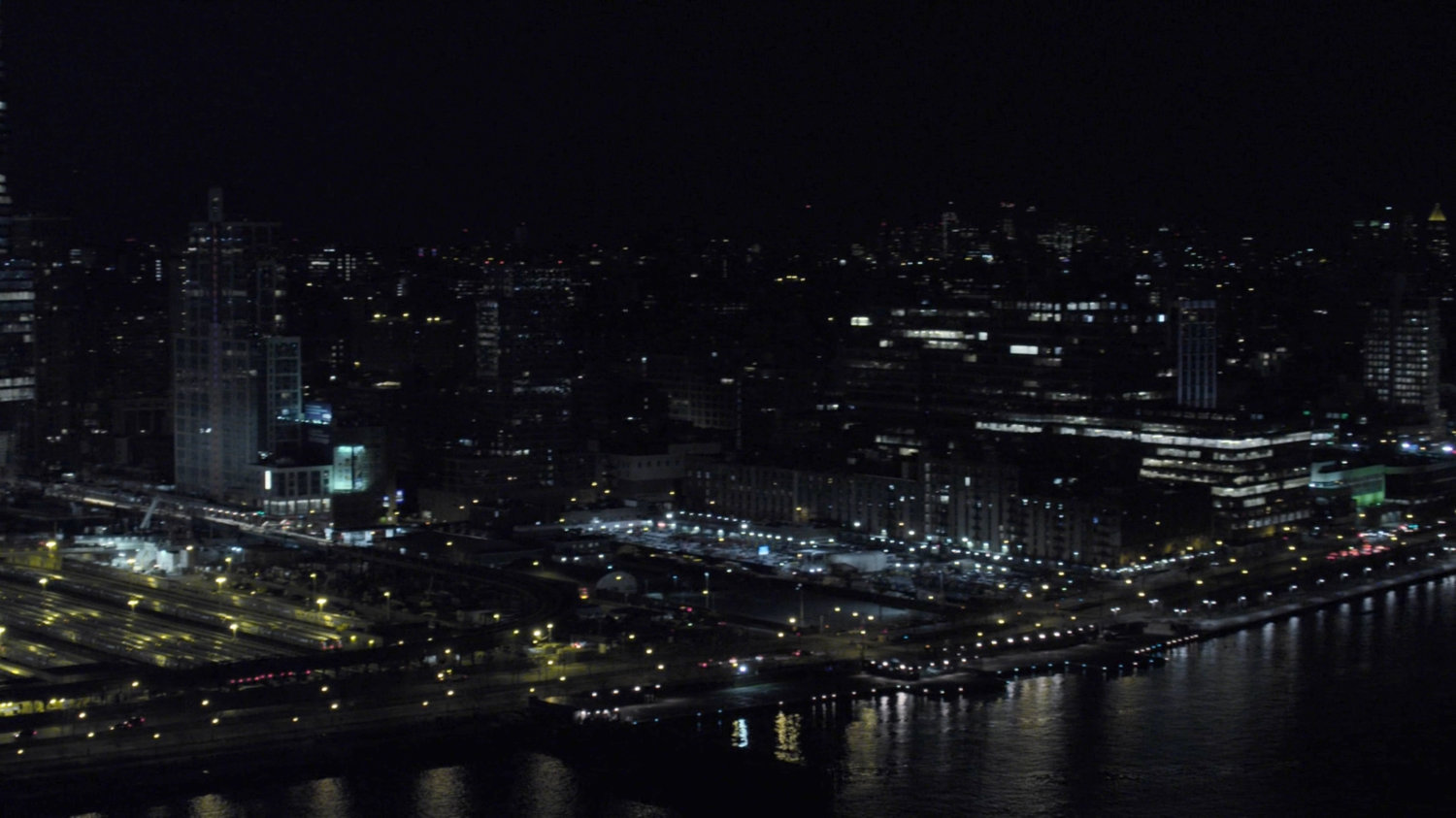 Aerial view of New York City at night.