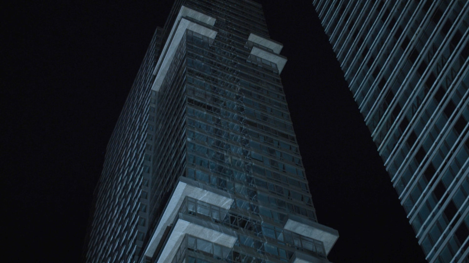 View of Midland Circle building at night.