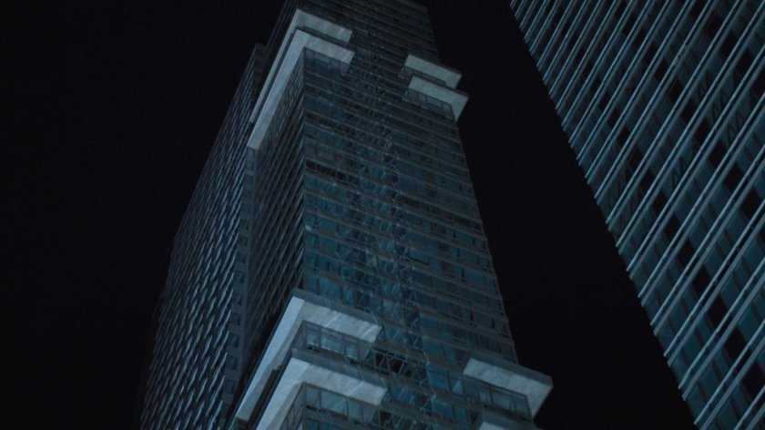 View of Midland Circle building at night.