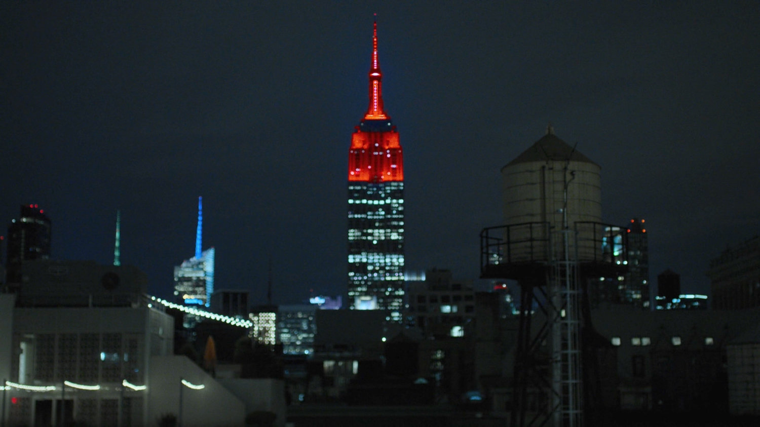 Midtown Manhattan from a rooftop at night.