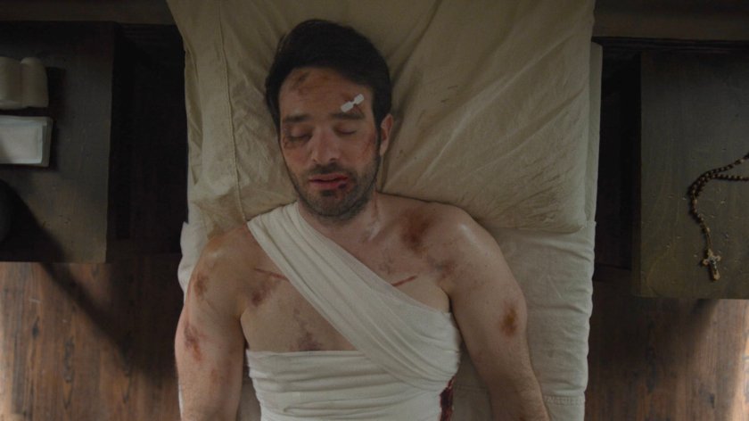 Matt lies unconscious in a bed at an orphanage.