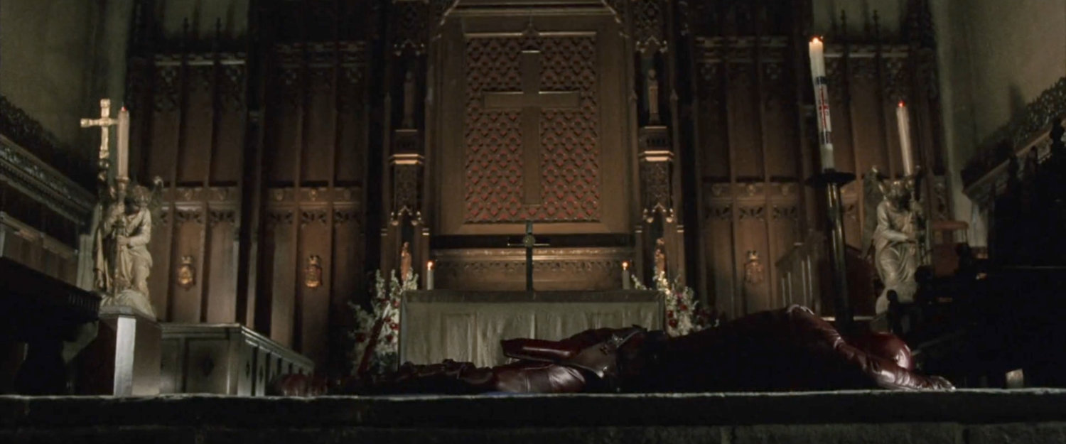 Daredevil lying on the chancel floor in the Church of the Holy Innocents.