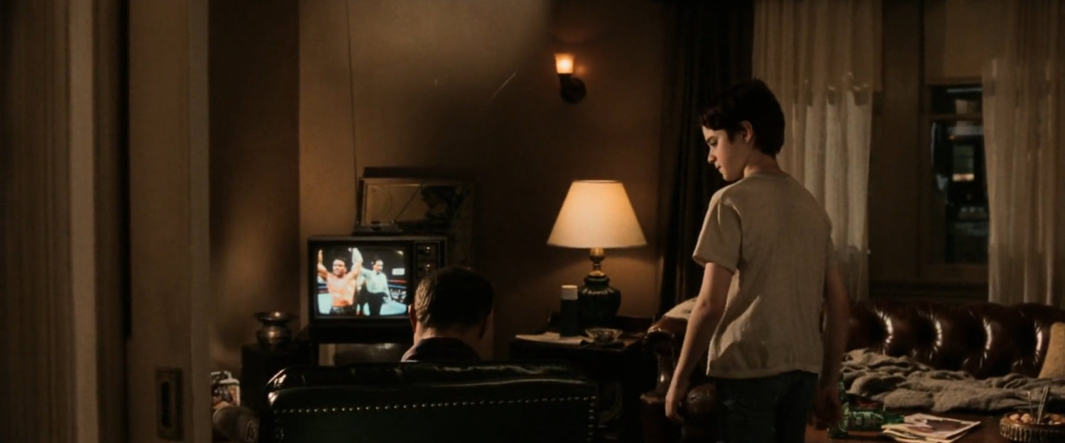 Young Matt in the living room of his apartment.