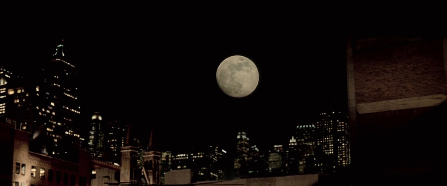 The New York skyline under a full moon.