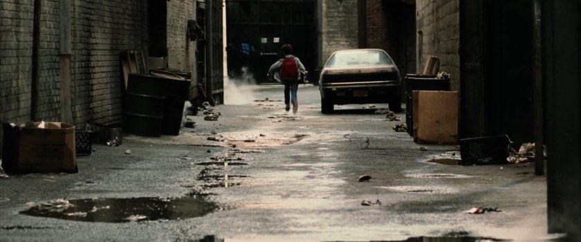 Young Matt running through an alley near Hudson Marine company.