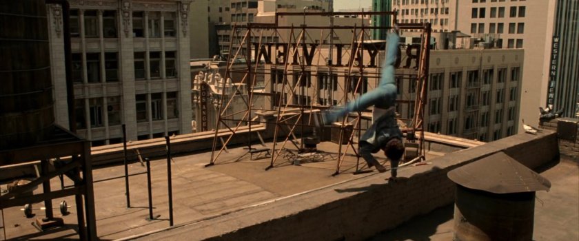 Young Matt practices acrobatics on rooftop of Murdock apartment building.