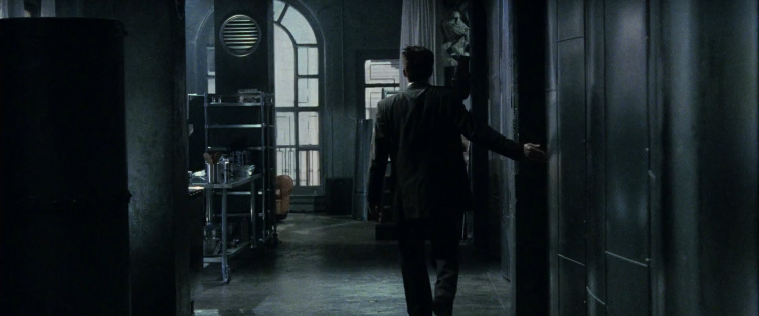 Matt entering his dark apartment.