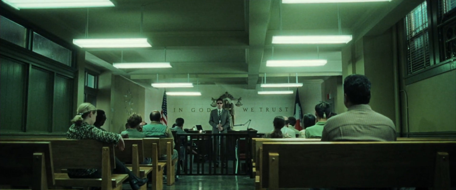 Matt in a small civic courtroom.