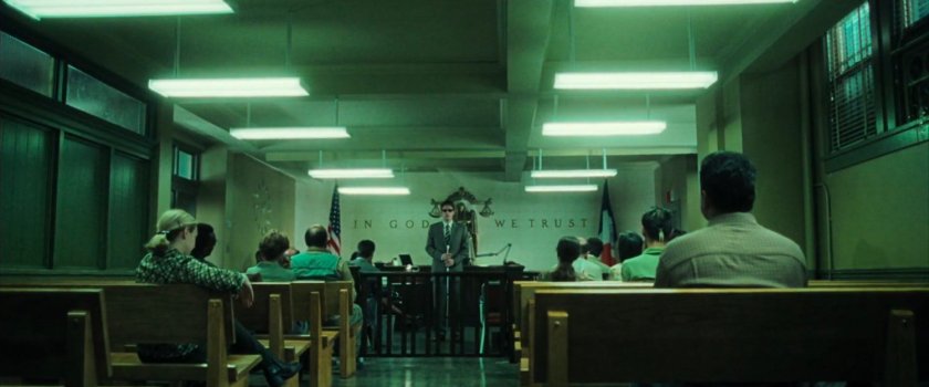 Matt in a small civic courtroom.