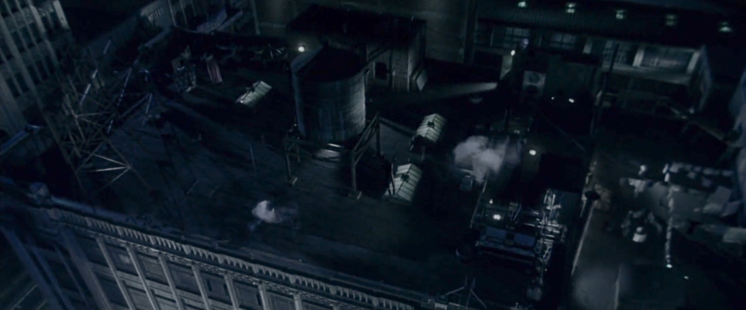 Daredevil leaping from rooftop to rooftop at night.