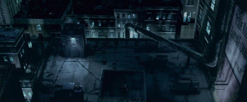 Daredevil running across a rooftop at night.