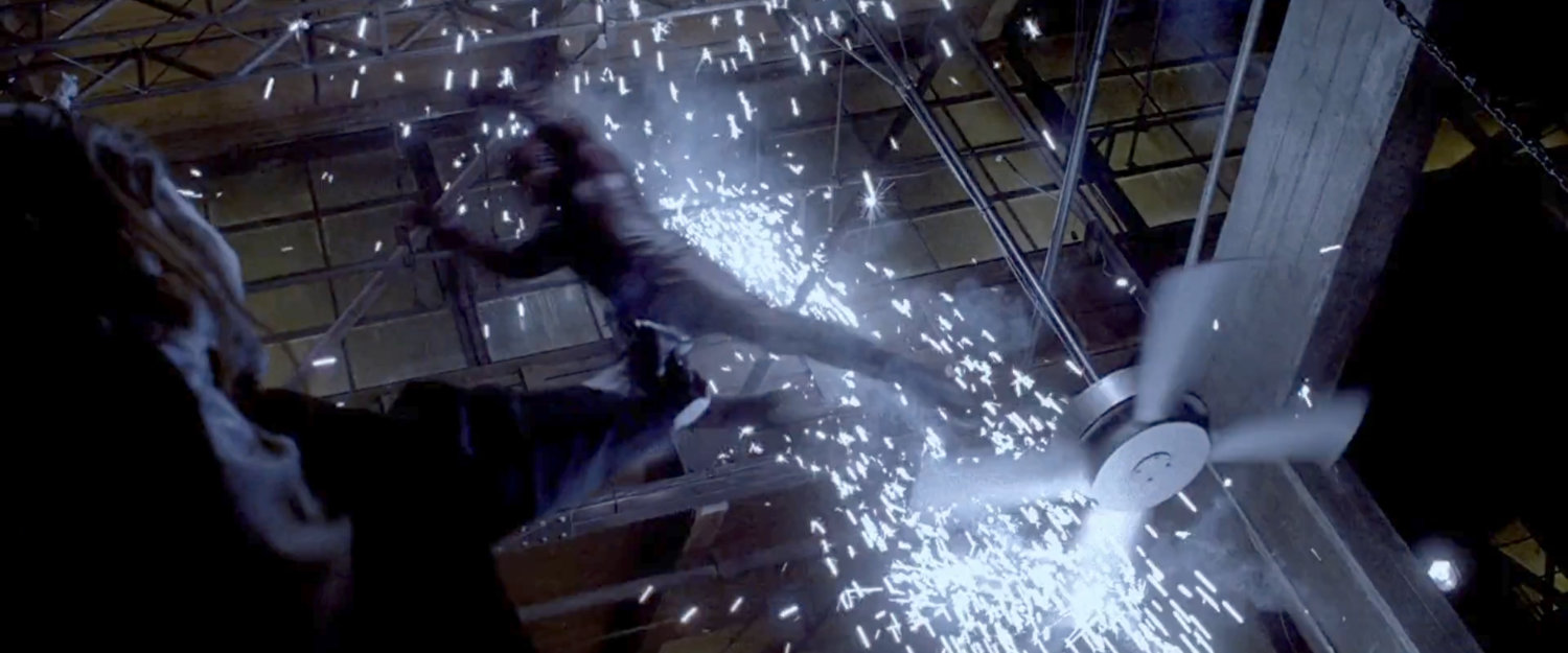Daredevil leaping from ceiling fan in Josie's bar.