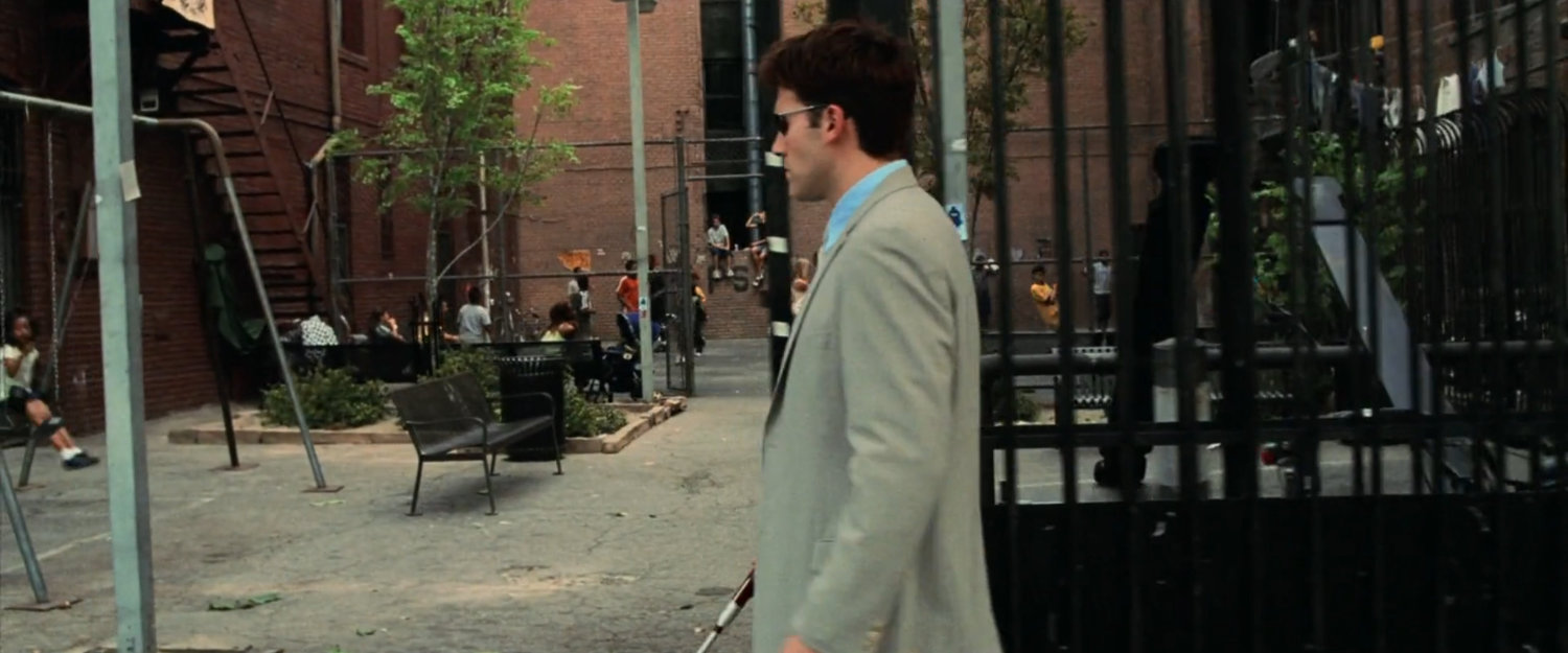 Matt on a sidewalk outside a New York playground.