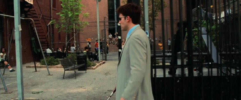 Matt on a sidewalk outside a New York playground.