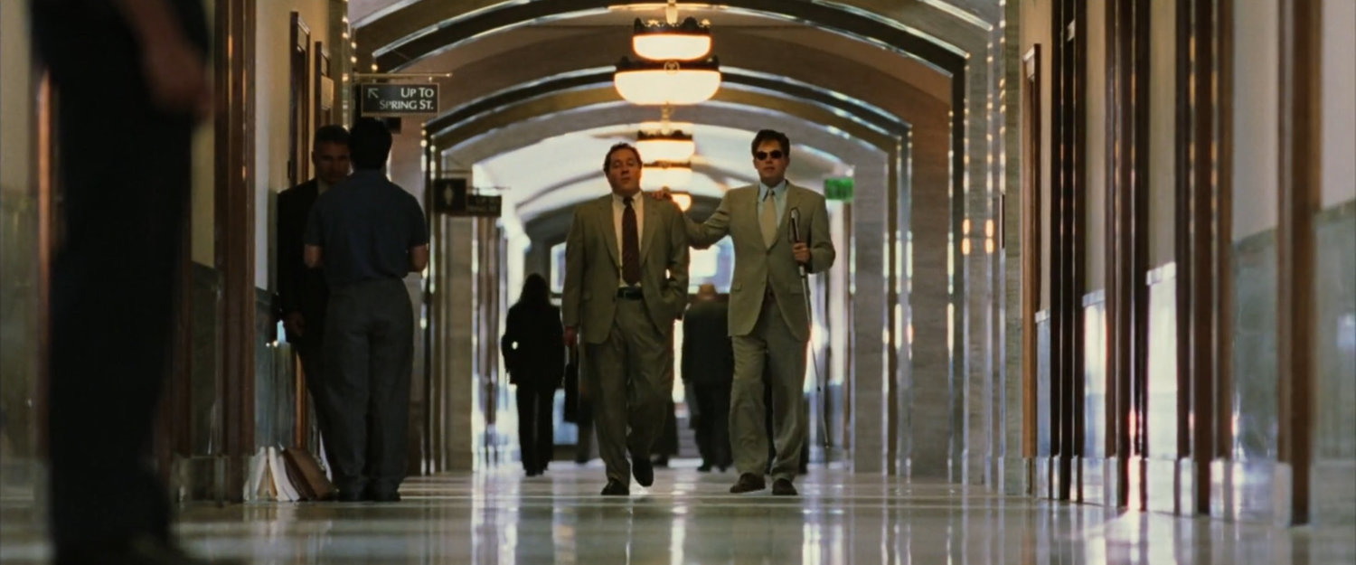 Foggy and Matt in a courthouse hallway.