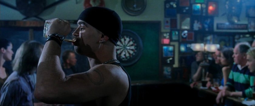 Bullseye drinking a beer at an English pub.