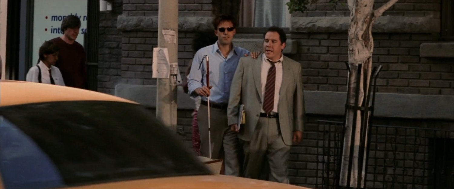 Matt and Foggy walking along a New York sidewalk.