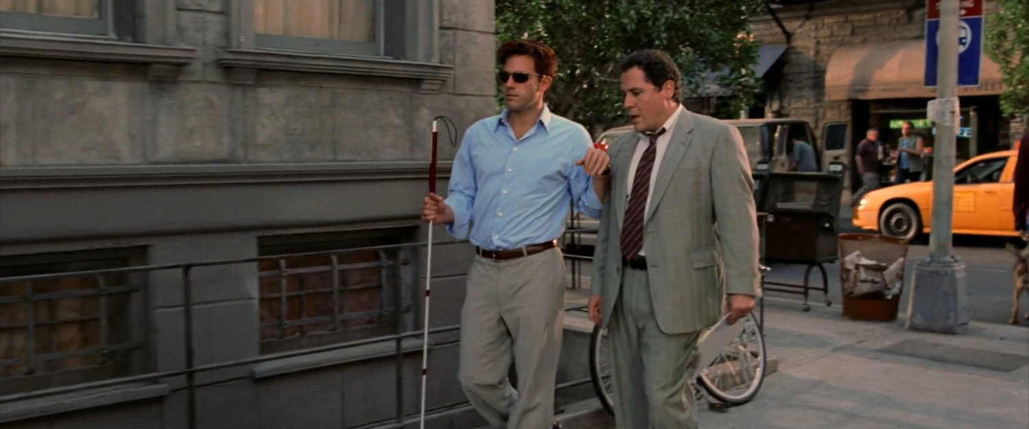 Matt and Foggy walking along a New York sidewalk.