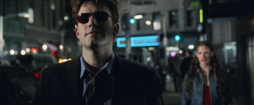 Matt and Elektra on a dark sidewalk.