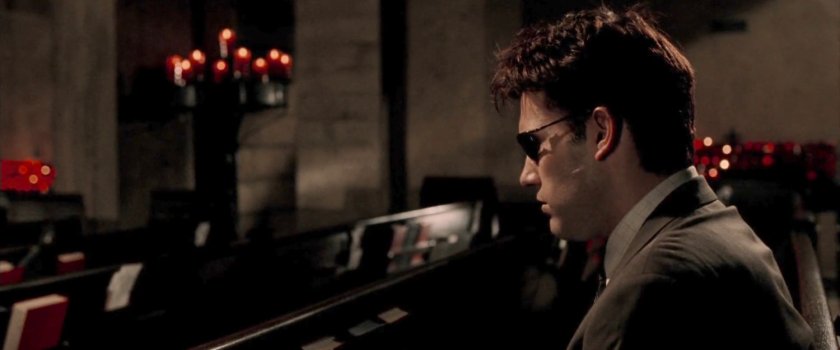 Matt Murdock sitting in a pew at the Church of the Holy Innocents.
