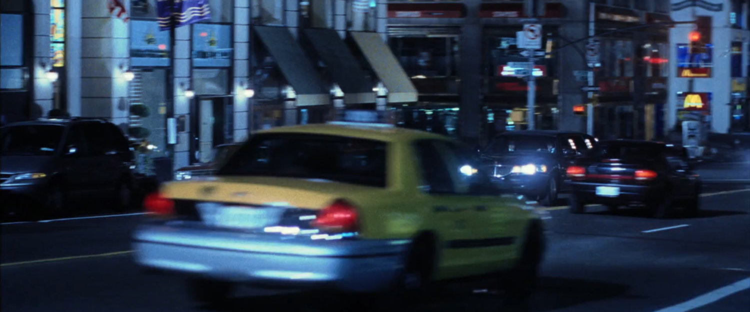 Limo driving along street in New York.