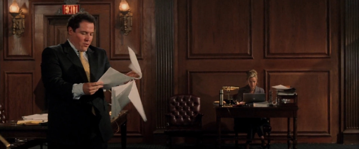 Foggy flipping through papers in a courtroom.