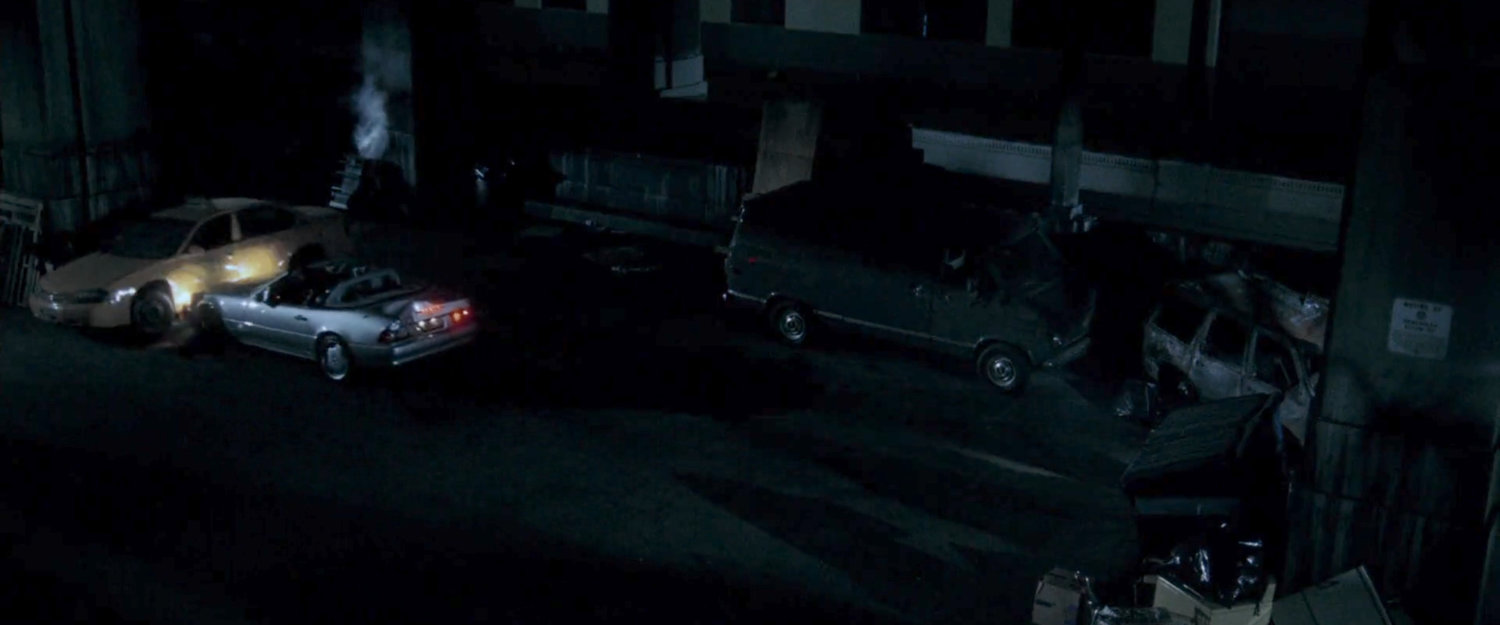 Mackenzie's car crashing into parked car outside topless bar.