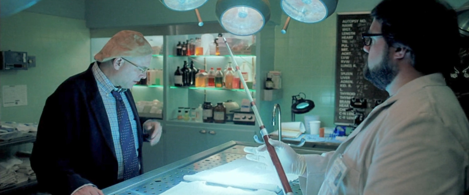 Ben Urich with Jack Kirby in city morgue.