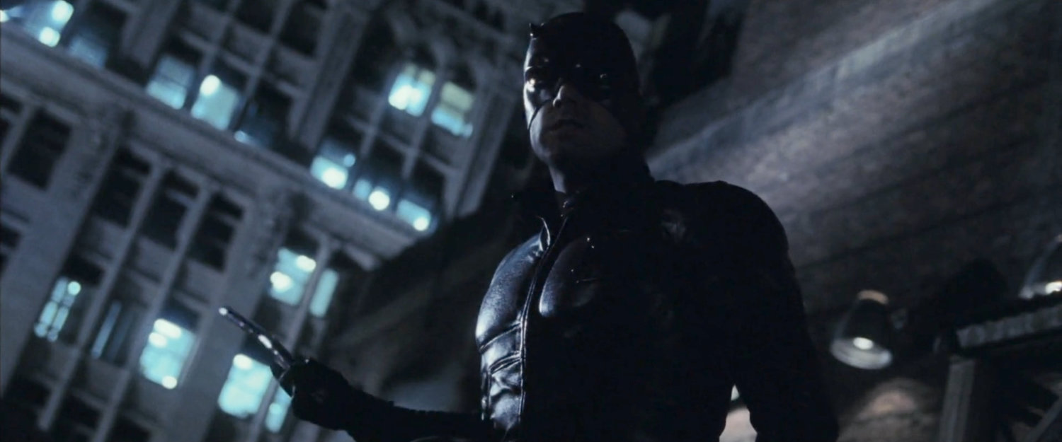 Daredevil on a dark rooftop.