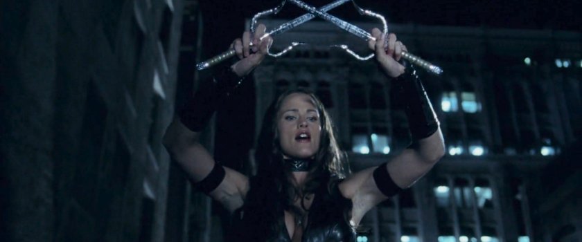 Elektra brandishes her Sais on a rooftop.