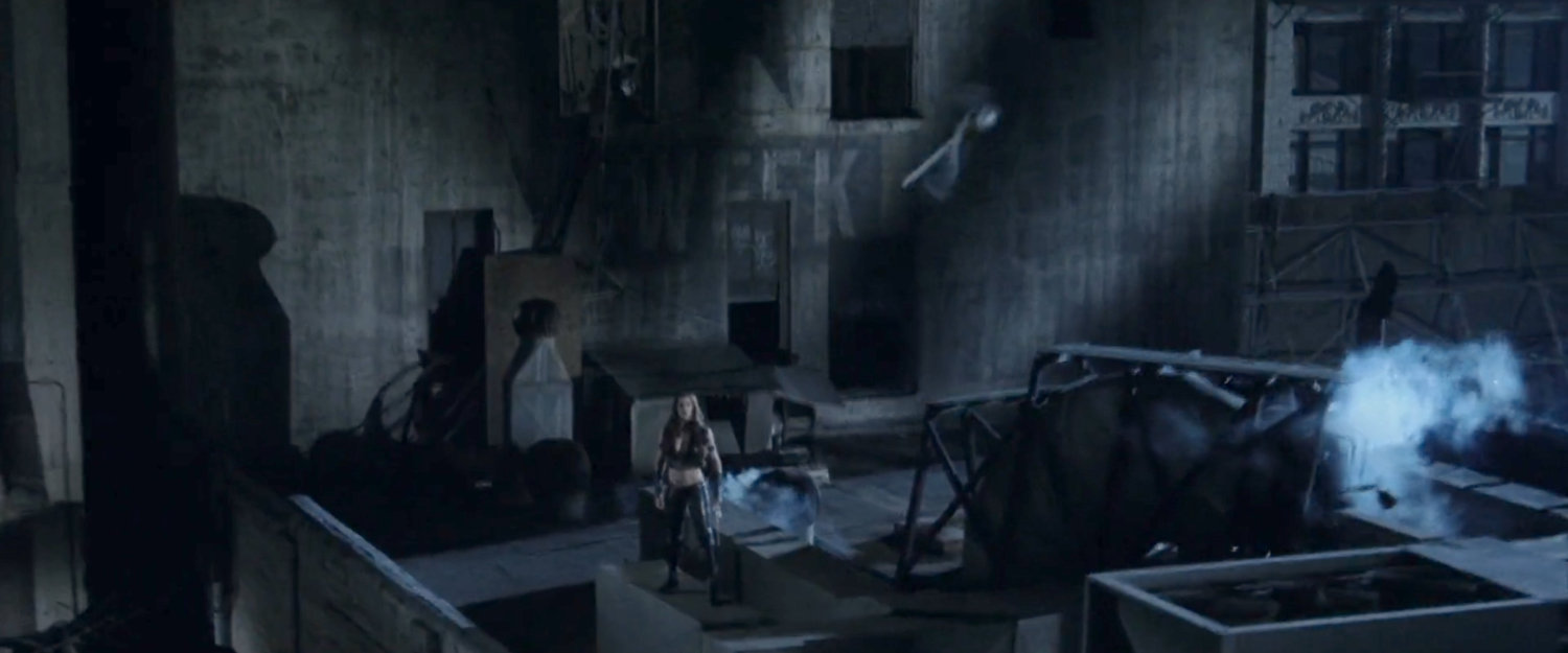 Elektra standing on a rooftop.