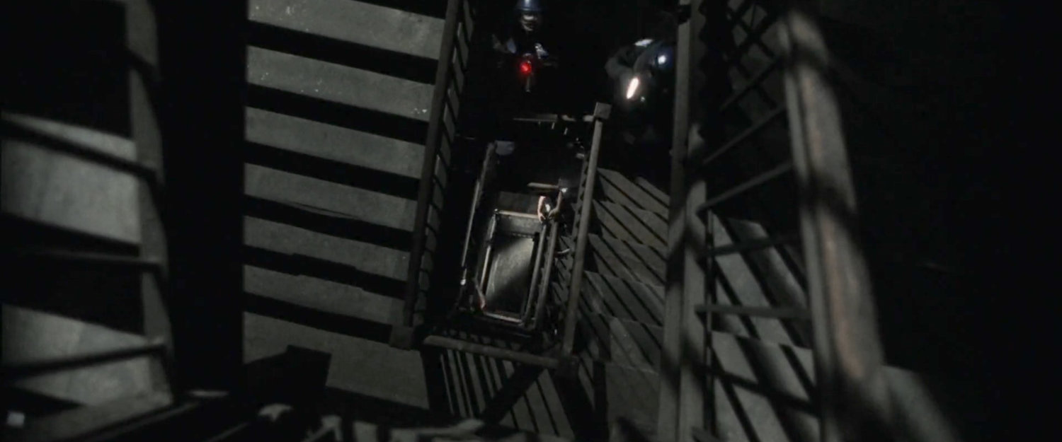 Looking down staircase in New York apartment building.