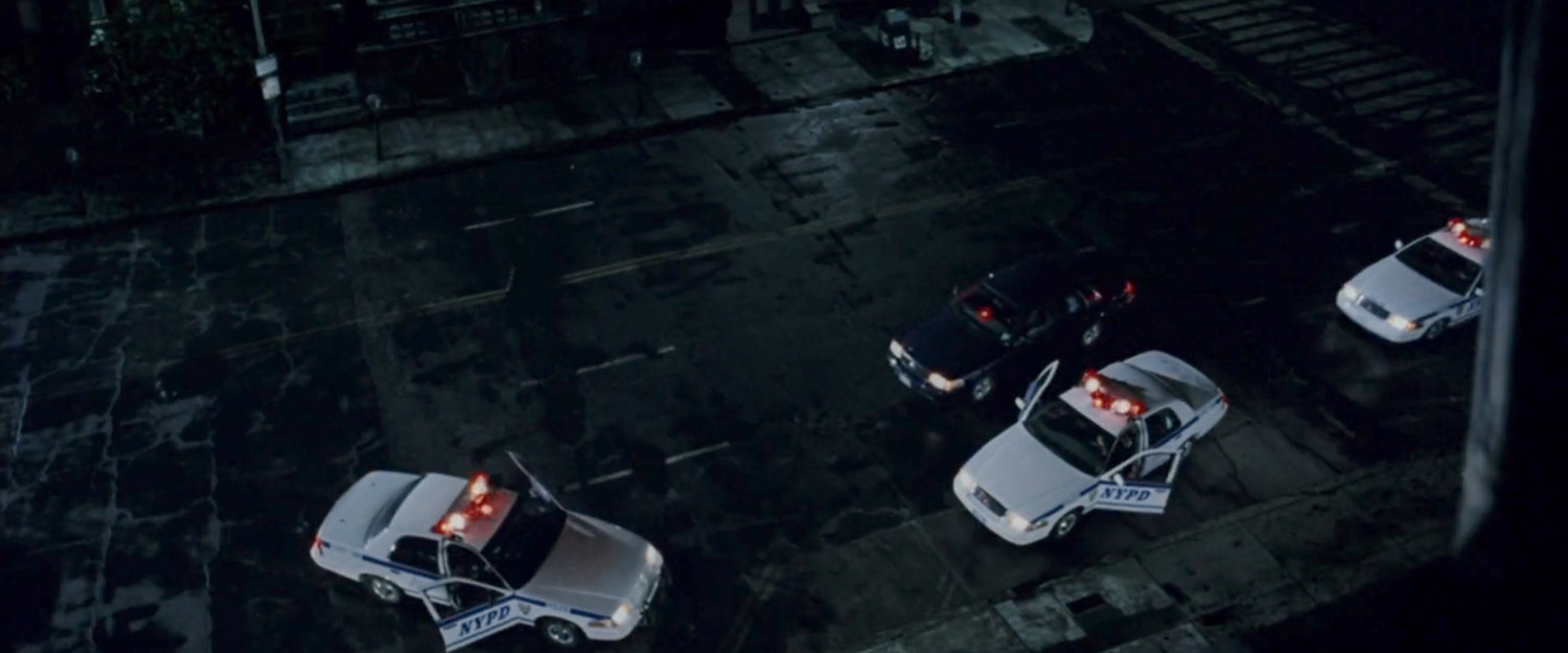 Police cars arriving outside the Church of the Holy Innocents.