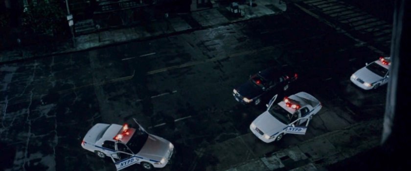 Police cars arriving outside the Church of the Holy Innocents.