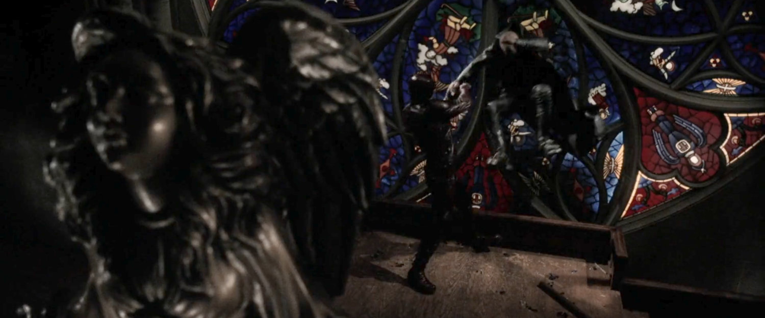 Daredevil tossing Bullseye through a stained glass window at the Church of the Holy Innocents.