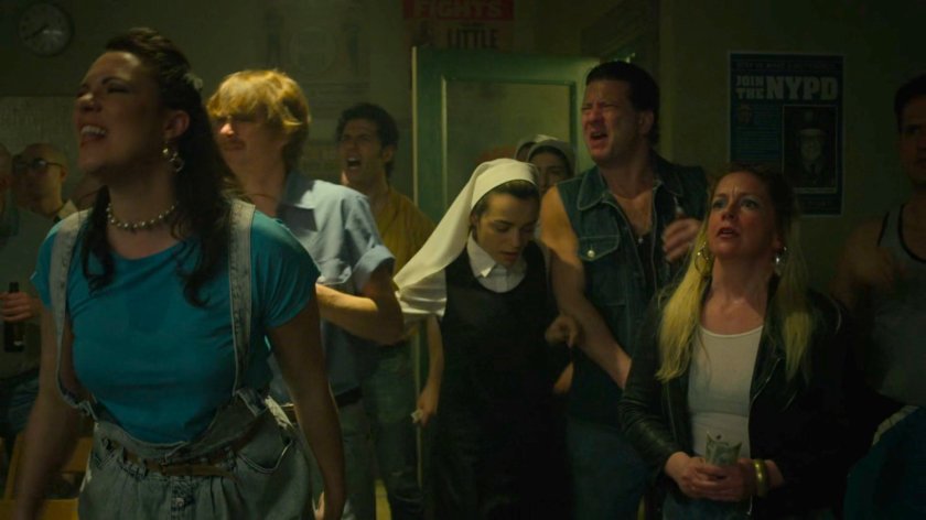 Novitiate Maggie pushes through a crowd at Fogwell's Gym.