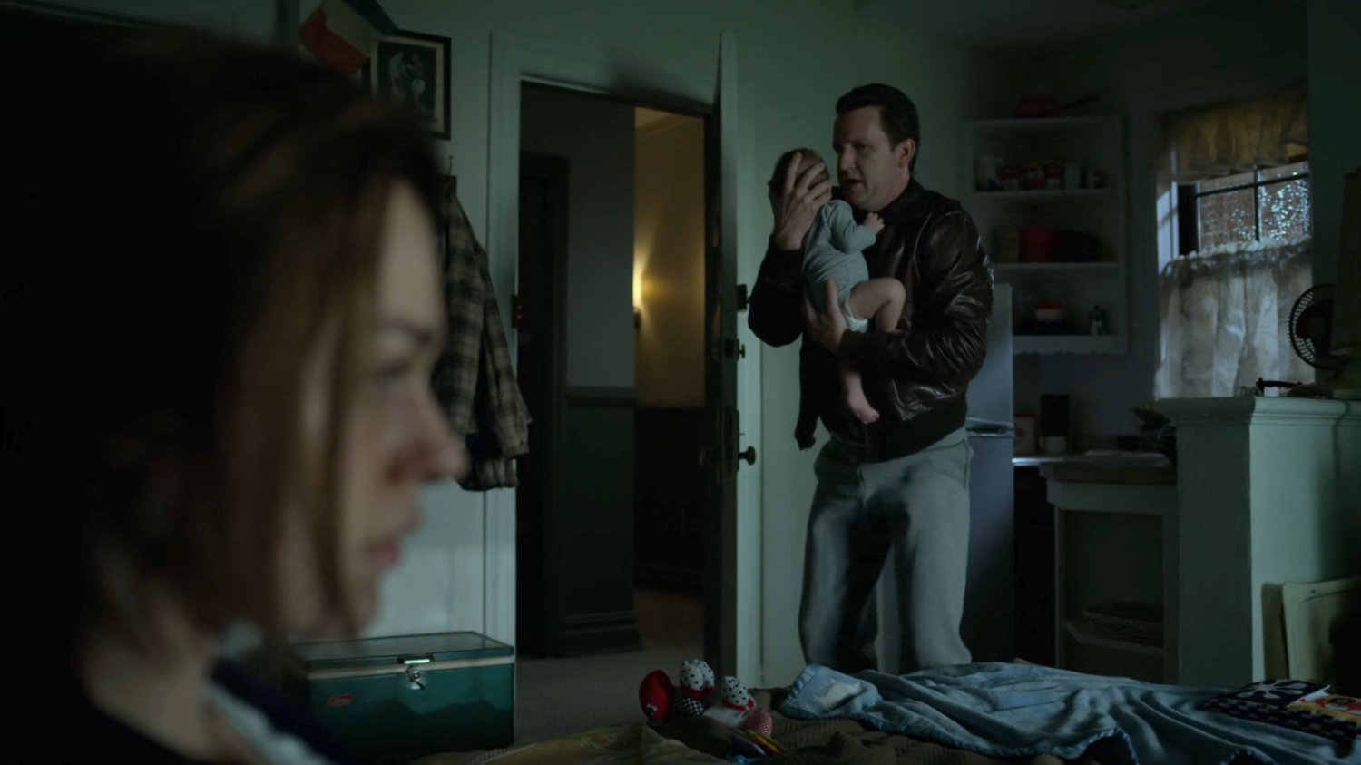 Maggie and Jack Murdock with baby Matt in their apartment.