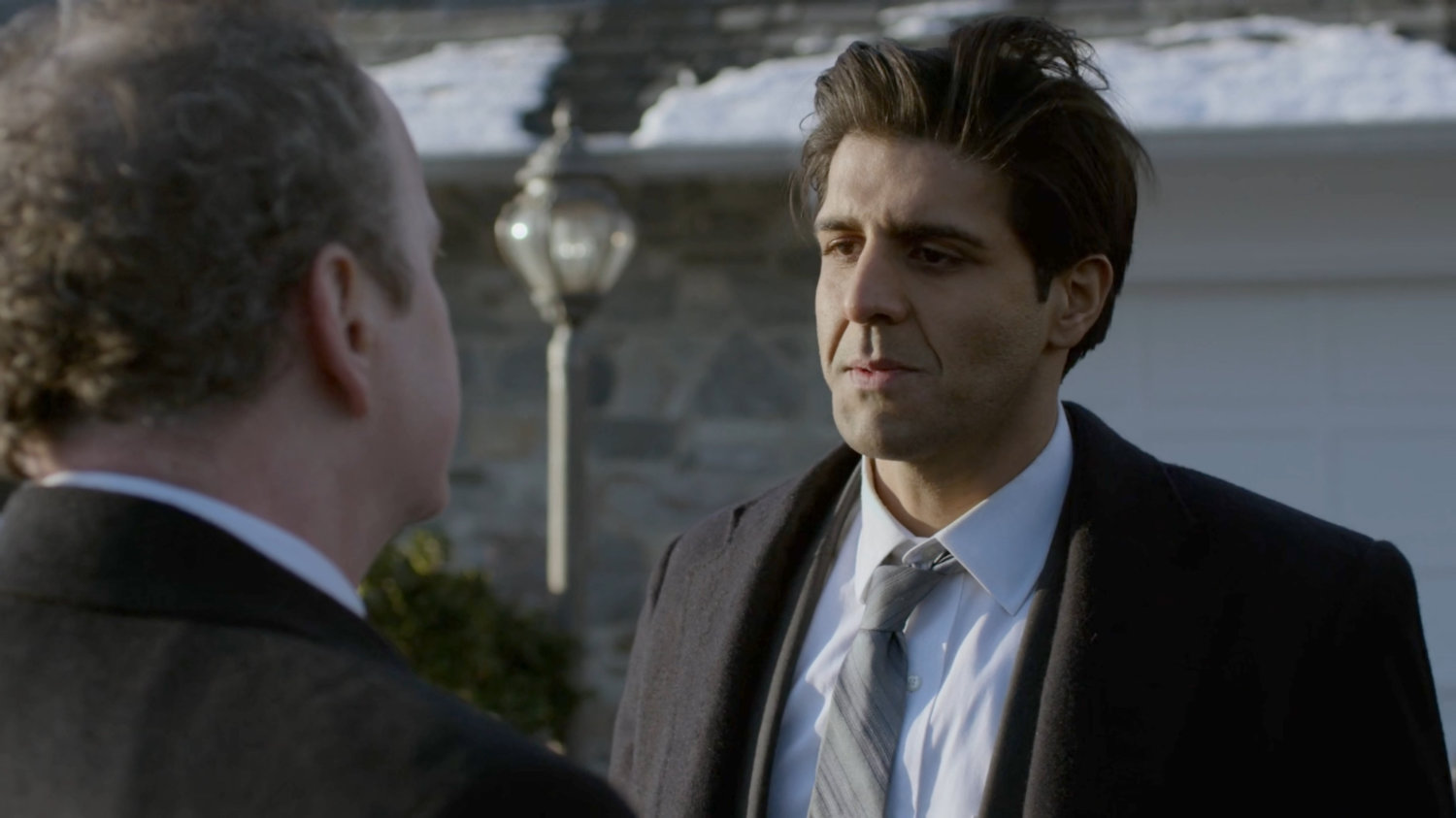 Ray Nadeem and Agent Winn in front of SAC Hattley's house.