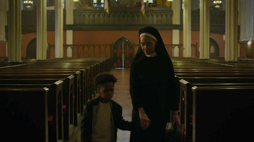 Sister Maggie and a young boy in Clinton Church.