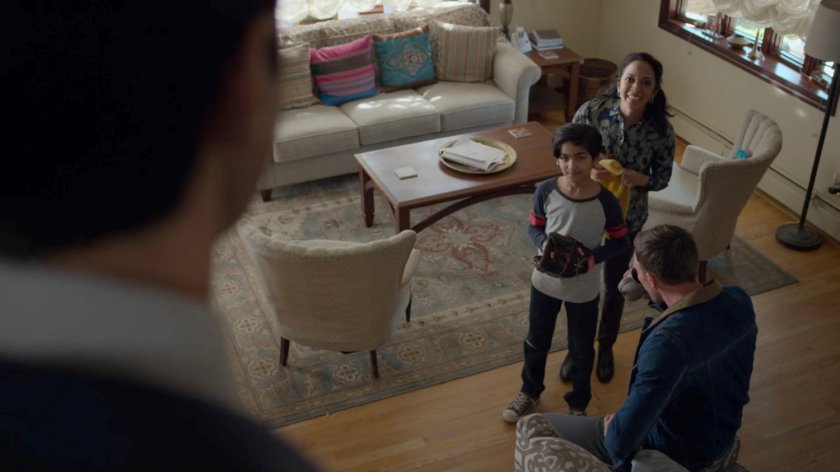 Sami and Seema talking with Dex in the Nadeem living room.